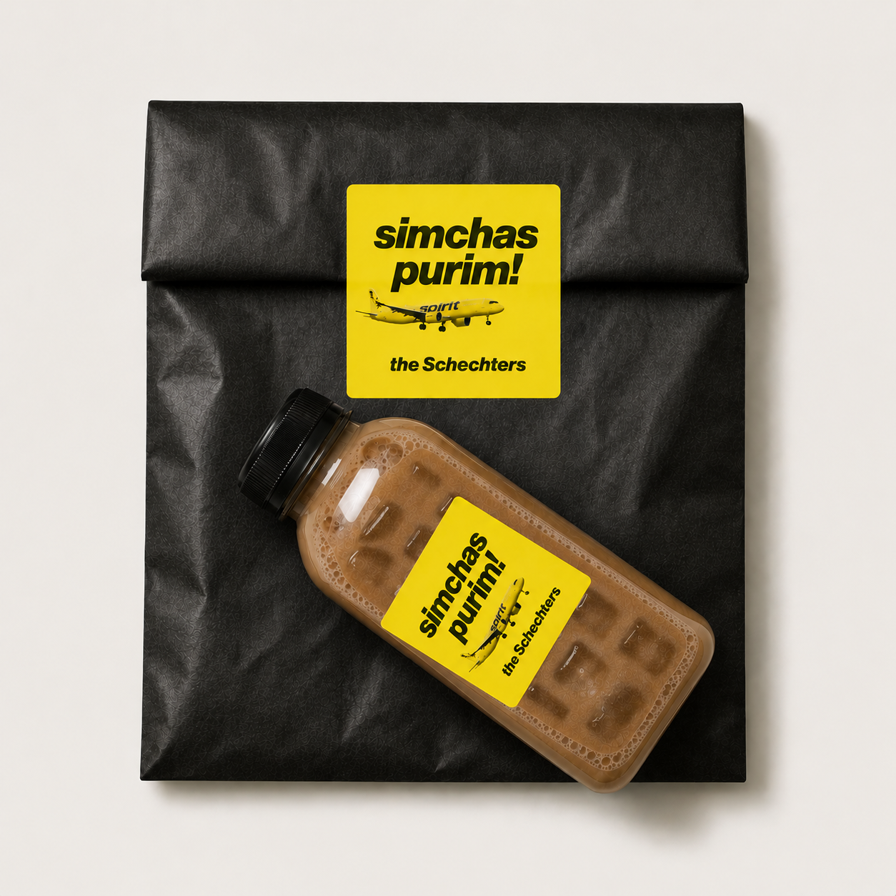 Yellow airline themed Simchas Purim label on a black bag and bottle