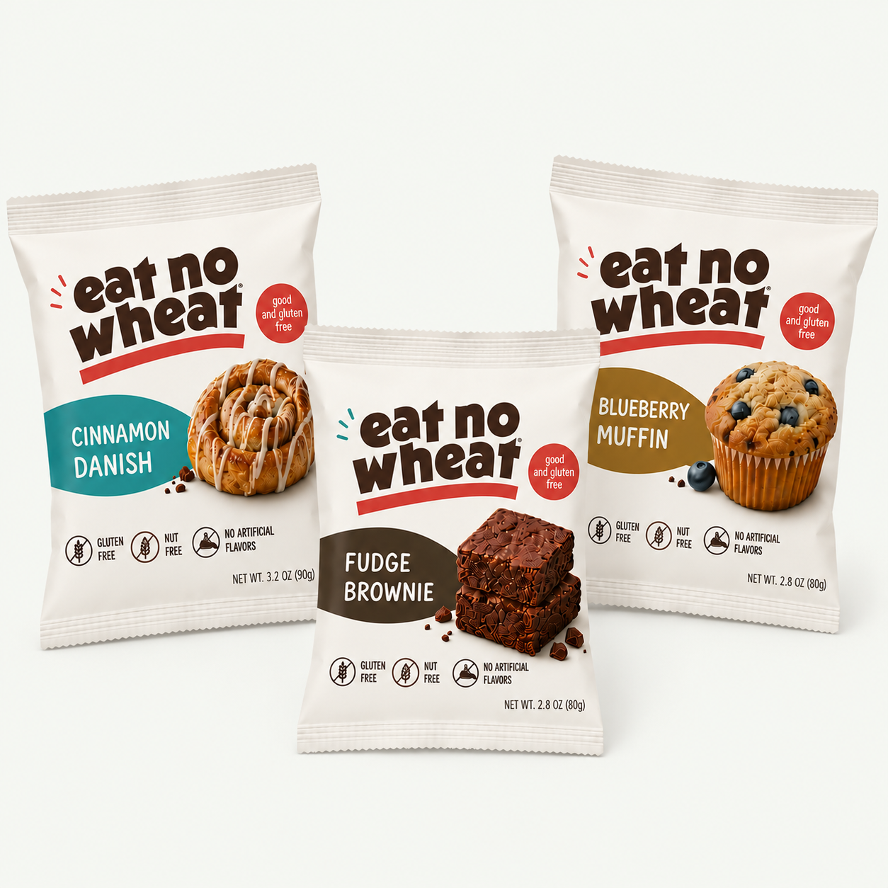 Three Eat No Wheat snack packages: cinnamon danish, fudge brownie and blueberry muffin